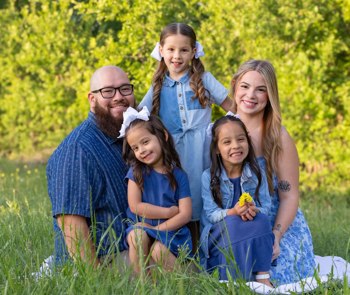 Family portrait seated together outdoors